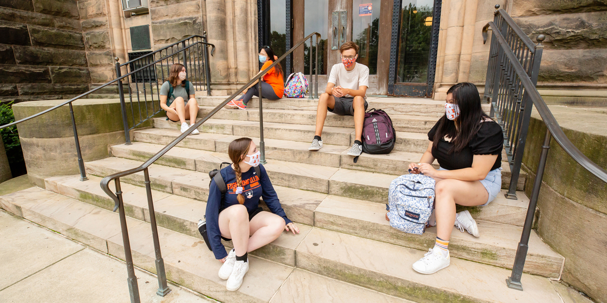 Students sitting on the steps of Altgeld