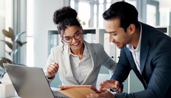 Technology, teamwork and professionals working with computer in modern workplace. 