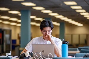 Student looking at laptop